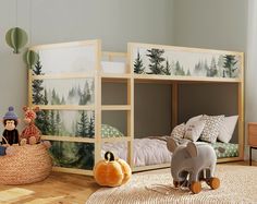 there are two children's bunk beds in this room, one has an elephant and the other has a stuffed animal