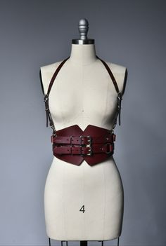 Burgundy oxblood leather corset style harness belt. Adjustable Leather Harness With Belt, Leather Harness With Straps, Leather Strapped Harness With Belt, Gothic Leather Harness With Belt, Fitted Leather Harness With Belt, Gothic Leather Corset Belt, Brown Leather Steampunk Corset Belt, Fitted Leather Harness With Straps, Leather Corset Belt For Festivals