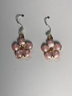 Pink Flower Earrings. These come in Pink and White. with a gold outline. Blossom Flower Earrings For Pierced Ears, Blossom Color Flower Earrings For Pierced Ears, Blossom Color Flower Earrings, Blossom Color Drop Earrings With Flower Charm, Blossom Colored Flower Shaped Jewelry With Matching Earrings, Pierced Rose Gold Flower Earrings, Rose Gold Flower-shaped Pierced Earrings, Rose Gold Flower Shaped Pierced Earrings, Rose Gold Flower Shaped Earrings For Spring