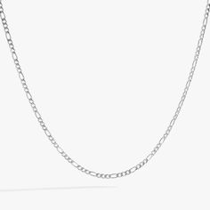 Layer on classic elegance with the Figaro Chain Charm Necklace Base, known for its distinctive pattern of elongated links interspersed with shorter links. This timeless style adds a touch of sophistication to any outfit, making it a versatile must-have for your jewelry collection. Attach trendy, custom charms that tell your unique story and create a look that's uniquely yours. Crafted to be worn every day, the stainless steel finish bracelet is water, scratch and tarnish-resistant. Our innovativ Classic Figaro Chain Metal Necklace, Silver Figaro Chain Link Necklace, Silver Figaro Link Chain Necklace, Elegant Figaro Chain Link Necklace, Classic Metal Necklace With Figaro Chain, White Gold Figaro Link Chain Necklace, Elegant Silver Figaro Chain Necklace, Elegant Silver Necklace With Figaro Chain, Metal Figaro Chain Link Necklace