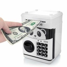 a person is holding money in front of a small box with a panda bear on it