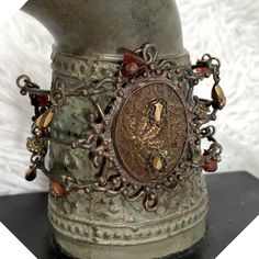 In Good Pre-Owned Vintage Condition. This Unique Piece Was My Grandmother’s. She Had Amazing Flair And Loved True Vintage Bohemian Style Jewelry. This Is A Delicate Piece So Needs To Be Treated With Care. Maya Vintage Rustic Beaded Wire Cuff Bracelet Brocade Center Crystals Handmade - Wire Work - Hand Beaded Stones, Crystals - Center “Stone” Is Covered With A Brocade Type Cloth. (Difficult To See In The Photos) - Hinged - Adjustable - Hook Closure Antique Brown Bracelet Ideal For Gifts, Antique Brown Bracelet Gift, Brown Metal Bracelets For Festival, Vintage Brown Beaded Bracelets For Festival, Bohemian Metal Bracelets With Antique Finish, Festival Brown Metal Bracelets, Brown Metal Bracelets For Festivals, Vintage Brown Beaded Festival Bracelets, Vintage Brown Beaded Festival Bracelet