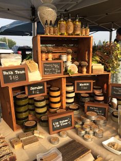 an outdoor market with lots of food on display