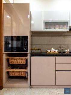 a kitchen with an oven, microwave and other items on the counter top in front of it