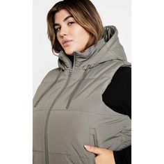 Show off a winter style that will elevate your rotation with our Ava Puffer Vest. An essential layer for cold days ahead, this puffer offers a trendy hood and sage grey hue. Bold and fiercely fashionable, no one does plus size fashion like City Chic. Loved around the globe for its diverse range of fashion-forward styles for any occasion. From show-stopping evening gowns to workwear and casualwear, City Chic will take your style to bold new heights. Available in sizes 14-32. Womens Quilted Jacket, Grey Vest, Winter Coats Women, City Chic, Chic Woman, Puffer Vest, Winter Style, Quilted Jacket, Hip Length