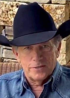 an older man wearing a cowboy hat