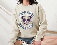 Presenting our funny mama bear sweatshirt and funny mama bear shirt! 💖 Give this cool and trendy sweater to your mama, aunt, grandma and mom friends! 🎁 🌸 Features 🌸 -Unisex Adult Sizing  -Light and Soft Cotton Fabric -Shirt: 100% Airlume Combed and Ringspun Cotton -Sweatshirt: 50% Cotton, 50% Polyester  -High-quality -Eco-friendly and Water-based Inks, Bio-degradable and Non-toxic -Any props used in the photos are for aesthetic purposes only; not included in the purchase -Rolled sleeves in t Cotton Long Sleeve Sweatshirt With Bear Print, Bear Print Crew Neck Sweatshirt For Streetwear, Bear Design Crew Neck Tops For Streetwear, Family Matching Graphic Print Sweatshirt, Crew Neck Bear Print Sweatshirt For Streetwear, Crew Neck Sweatshirt With Bear Print For Streetwear, Streetwear Crew Neck Sweatshirt With Bear Print, Casual Bear Print Tops For Fall, Casual Bear Design Crew Neck Top