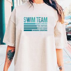 a woman wearing a shirt that says swim team