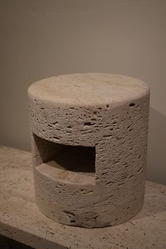 a stone object sitting on top of a table