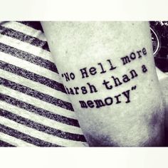 a person with a tattoo on their arm that says, no hell more harsh than a memory