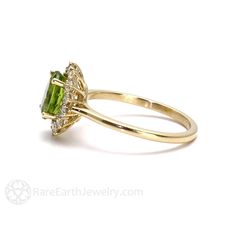 Gorgeously feminine, a pretty Peridot and diamond ring in your choice of 14K or 18K White, Yellow or Rose Gold. At the center is a 1.35ct lovely Peridot, surrounded by a halo of conflict free diamonds, .40cts total weight. So pretty! Peridot is the birthstone for August. Made to order. Please allow three to four weeks for delivery. ABOUT THIS RING Composition: 14K Gold or 18K Gold Shown on Ring Size 6.5 Finger Center Stone: Natural Peridot Color: Yellowish Green Approx. Weight: 1.35ct Shape/Cut: Cluster Ring For Wedding With May Birthstone, Elegant Cluster Ring With May Birthstone, May Birthstone Cluster Ring With Gemstones, Gemstone Cluster Ring For May Birthstone, Heirloom Diamond Ring With Halo Setting For May Birthstone, Ring Composition, Peridot Color, Green Gemstone Ring, Yellowish Green