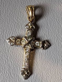 "JJT Sterling Silver 18k Gold Plate Cubic Zirconia Cross Signed. Cross is fully hallmarked and will arrive gift boxed. * HALLMARKS 925, JTT, CZ. * MEASUREMENTS 1 9/16\" including bale x 7/8\" * WEIGHT 3.17 Grams. * CONDITION In very good to excellent condition. Please use pictures as part of item's description. * MATERIALS Cubic Zirconia, 925, 18k Gold Plate." Antique Style Rhinestone Jewelry For Anniversary, Antique Gold Jewelry With Rhinestones, Vintage Gold Jewelry With Cubic Zirconia, Victorian Gold Jewelry With Rhinestones, Victorian Jewelry With Rhinestones For Anniversary, Victorian Rhinestone Jewelry For Anniversary, Antique Rhinestone Jewelry For Anniversaries, Luxury Cubic Zirconia Crucifix Jewelry, Vintage Cross Jewelry For Anniversary