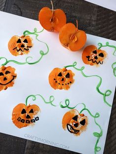 some oranges that have been made to look like jack o lantern pumpkins