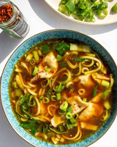 a bowl of soup with noodles and vegetables