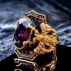 We used amethyst stones on our 925 sterling silver eagle ring warrior ring we made 3D double headed eagle on crossed double sword the coloring of the ring is 24k gold plated eagle men ring, 20-25 grams.  Double headed eagle, sword ring, amethyst stones, eagle men ring, warrior ring, gold plated, crossed double sword, eagle PRODUCT DETAILS * Made to Order * Certified 925 sterling silver * Your ring comes in a pretty ring box ready for gift giving. RING SIZE *It is always safer to see a jeweler to Gold Men Ring, Ring Symbolism, Warrior Ring, Double Headed Eagle, Eagle Ring, Mens Rings Fashion, Pretty Ring, Amethyst Stones, Unusual Rings