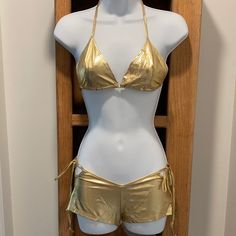 Elegant Moments Gold String Top & Shorts. Gold Bottoms For Summer Festival, Gold Tie-side Bottoms For Beachwear, Gold Tie-side Bottoms For Summer, Gold Beachwear Bottoms For Vacation, Gold Beachwear Bottoms For Summer, Spring Beach Gold Bottoms, Stretch Gold Bottoms For Beach, Gold Bottoms For Summer Vacation, String Top