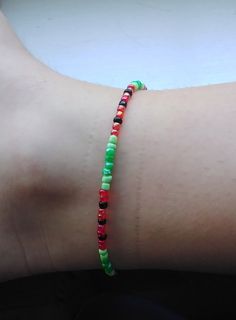 This is a great summer bracelet to wear to all places. Not only is it everyones favorite fruit its also a sweet piece of jewelry. Casual Colorful Beaded Festival Bracelets, Casual Multicolor Beaded Anklets, Green Tiny Beads Friendship Bracelets For Summer, Handmade Casual Anklets For Vacation, Casual Green Anklets, Trendy Anklets With Round Beads For Festivals, Trendy Round Bead Anklets For Gift, Green Bracelets With Tiny Beads For Summer, Casual Round Beads Anklets For Vacation