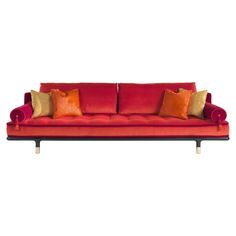 a red couch with orange and gold pillows on it's back end, against a white background