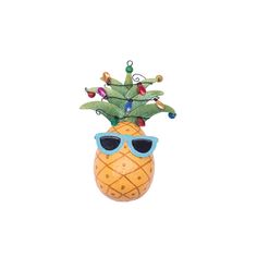 a pineapple with sunglasses on it's head is hanging from a string and decorated with christmas lights