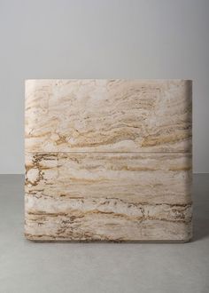 a white marble block sitting on top of a table