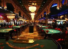 an indoor casino with tables and chairs