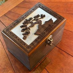 a wooden box sitting on top of a wooden floor