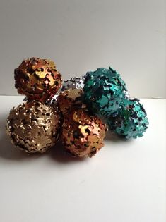 five different colored balls sitting on top of each other