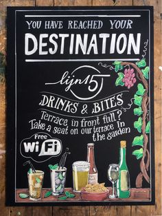 a chalkboard sign that says you have reached your destination with drinks and bites on it