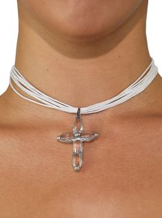 With an enduring beauty that's impossible to resist, our Aurora necklace is made to be loved for a lifetime. Featuring a multi-rope cord appearance in a classic white & a clear cross pendant with silver detailing. Details Multi-rope white choker Cross pendant Adjustable closure Model Info Waist 25" Chest 33" Hips 36" Height 5'7 Spiritual White Multi-strand Jewelry, Adjustable White Cross Necklace, Adjustable White Cross Necklaces, White Adjustable Cross-shaped Jewelry, White Choker, White Rope, Rope Cord, Chic Summer Outfits, Cross Charms