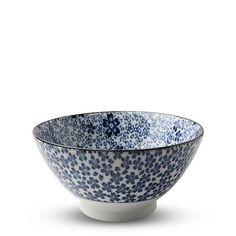 a blue and white bowl sitting on top of a table