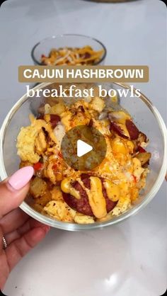 someone is holding a bowl full of food with the words cajun hashbrown breakfast bowls