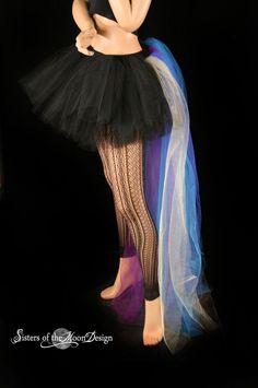 "Handmade from 25yards, two layers of soft smooth Black Bridal tulle, that has been gathered and serged to the black fabric covered elastic waistband, the back bustle(attached) is made from two layers of long bridal tulle in gold, royal, turquoise, purple, teal. It is around 50\" long and will trail behind you! This skirt is not made yet, It is made when ordered! Measurement: Sizes go by (in inches) smallest waist size tutu will fit, to largest Hips tutu fits over XSmall 24\"-34\" Small 26\"-38\ Stretch Petticoat For Halloween Costumes, Halloween Stretch Tulle Petticoat, Stretch Tulle Petticoat For Halloween, Fitted Tutu Dress For Carnival Costume Party, Fitted Tutu Dress For Costume Party And Carnival, Carnival Costume Party Fitted Tutu Dress, Stretch Tulle Tutu Dress For Costume Party, Fitted Tulle Costume For Costume Party, Fitted Tulle Skirt Tutu Dress For Costume Party