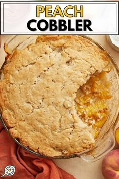 a peach cobbler in a pie pan with the words peach cobbler above it