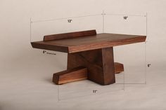 a wooden table with measurements for the top and bottom section, including one end that has been cut out