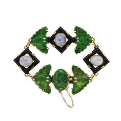 An unusual mid-century green jade butterfly bracelet made in 18k with links of carved onyx set with cabochon light blue sapphires. The bracelet was made in the 1960s and has the mark WL for Walter Lampl, who sold and made jewelry in New York. The jade butterflies are intricately carved, and the light blue sapphires accent all the bold colors. The bracelet is eclectic and interesting. It is 7 inches long and 0.75 inches wide. Marked WL and 18k. Mid-century Cabochon Jewelry For Formal Occasions, Art Deco Jade Jewelry For Formal Occasions, Formal Art Deco Jade Jewelry, Mid-century Green Collectible Jewelry, Mid-century Green Formal Jewelry, Jade Butterfly, Light Blue Sapphire, Modern Bracelets, Gold Link Bracelet