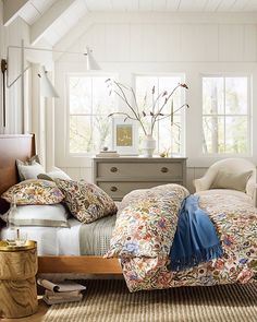 a bed room with a neatly made bed