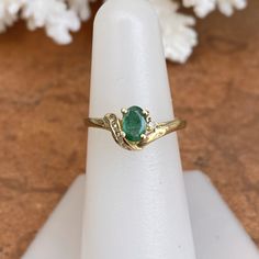 Estate/ vintage 14KT yellow gold ring with oval, genuine emerald + diamond accents. Stunning deep, green color on this emerald. Emerald is the birthstone for May babies + this ring makes a fantastic gift! Size 6.5 Weight: 2.10g Genuine, oval-cut, emerald measures: 6.5mm x 5mm .65~ .70 CT natirual diamonds (6) round diamonds; SI/I clarity; I color Stamped 585 (14K) Excelent estate condition Fine Jewelry Emerald Oval Cabochon Ring For May Birthstone, Heirloom Oval Emerald Ring, Heirloom Oval Green Emerald Ring, Gold Emerald Ring For May Birthstone, Oval Shape, Oval Emerald Ring In Gold, Oval Emerald Ring With Accent Stones, Heirloom Oval Emerald Ring Birthstone, Heirloom Oval Emerald Birthstone Ring, Oval Green Gemstone Birthstone Ring