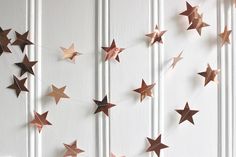 some brown stars are hanging on the wall