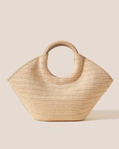 Raffia basket tote with round handle in soft calf leather. Made in Spain by uniquely talented artisans, celebrating excellence in craftsmanship. Chic Natural Beach Bag With Handles, Elegant Natural Straw Tote Bag, Elegant Tote Beach Bag With Braided Handles, Chic Beach Bag With Braided Handles, Elegant Bucket Straw Bag With Leather Handles, Modern Beige Straw Bag With Double Handle, Elegant Straw Bucket Bag With Leather Handles, Elegant Beach Bag With Braided Handles, Chic Double Handle Beach Bag With Bamboo Handle