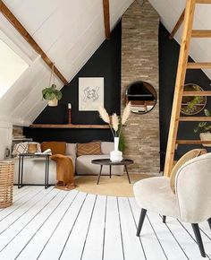 a living room filled with furniture and a fire place next to a wall mounted clock