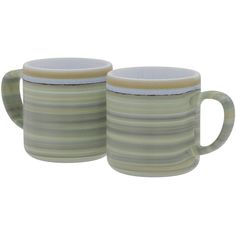 two coffee mugs sitting next to each other