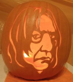 a pumpkin carved to look like the face of rock and roll singer patti smith is shown