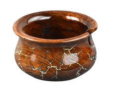 a wooden bowl with marbled designs on the outside and inside, is shown against a white background