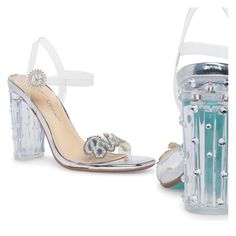 A Clear Block Heel And Sparkling Embellishment Bring A Glamorous Energy To This Runway-Ready Sandal. 3.75" Heel Adjustable Ankle Strap With Buckle Closure Cushioned Insole Open Toe Slingback Block Heel Lucite Upper/Manmade Sole Imported Clear Block Heel Sandals For Party, Clear Block Heel Party Shoes, Clear Block Heel Party Heels, Clear Ankle Strap Sandals For Party, Glamorous Wedding Shoes With Heel Strap For Events, Clear Open Toe Heels For Prom, Clear Sandals For Spring Wedding, Spring Wedding Clear Sandals, Glamorous Clear Ankle Strap Sandals