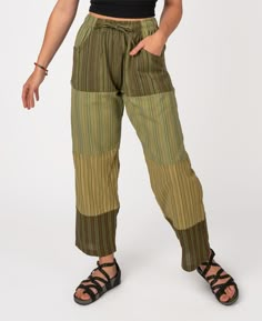 Our lightest weight beach pants! Whether you're just looking to kick back or you're out combing the beach for shells, these lightweight patchwork pants are just the right jam.  Made from a few different lightest weight, striped fabrics patched together, they have two front pockets, one back pocket, and a drawstring/elastic waist. A favorite of our patchwork clothing options at Soul Flower! Shades will vary as is the nature of patchwork. Wear these puttin' on the jams patchwork pants or any of ou Upcycled Clothes Aesthetic, Green Patchwork Pants For Spring, Summer Beach Parachute Pants With Pockets, Summer Straight Pants With Patchwork, Summer Wide Leg Pants With Patchwork, Summer Wide Leg Patchwork Pants, Relaxed Fit Patchwork Bottoms For Summer, Wide Leg Pants With Patchwork For Summer, Green Patchwork Bottoms For Summer