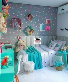 a child's bedroom decorated in pastel colors with polka dots on the walls