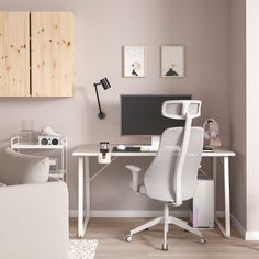 a white desk and chair in a room