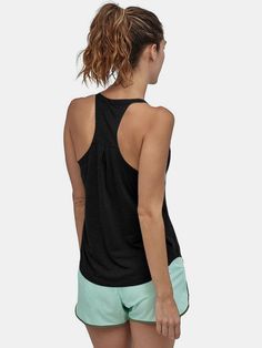 Get ready to get active with our Scoop Neck Active Tank! Perfect for summer workouts, this tank will keep you cool and comfortable while you break a sweat. With a stylish scoop neck design, you'll be ready to hit the gym or the park in style. Sheer: Opaque Stretch: Moderate stretch Material composition: 65% cotton, 35% polyester Care instructions: Machine wash cold. Tumble dry low. Imported Black Scoop Back Top For Summer, Breathable Racerback Tank Top For Sports, Moisture-wicking Racerback Activewear For Light Exercise, Sporty Racerback Tank Top For Yoga, Sportswear Racerback Tank Top Sweat Resistant, Yoga Racerback Tank Top With Mesh Back, Racerback Moisture-wicking Tank Top For Gym, Moisture-wicking Racerback Tank Top For Gym, Moisture-wicking Racerback Tank Top