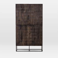 a tall wooden cabinet with metal legs and drawers on it's sides, against a white background