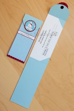 an empty blue paper bookmark on top of a wooden table